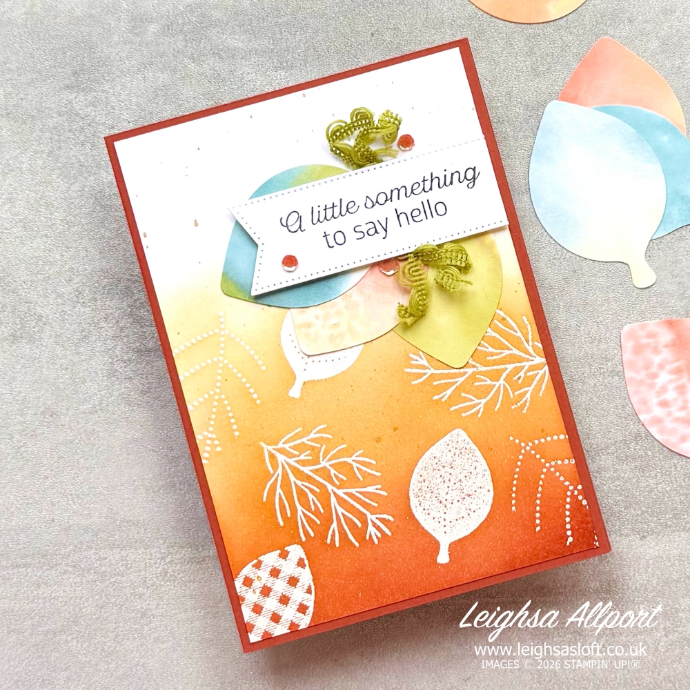 Autumnal Ombre Background. A little something to say Hello card, using Simply Leaves Bundle. Emboss resist background blended with Cajun Craze, Timid Tiger and Golden Glow to create an ombre effect. Leaves punched from Basic White coloured by adding blends to acrylic block, spritzing with alcohol and stamped.