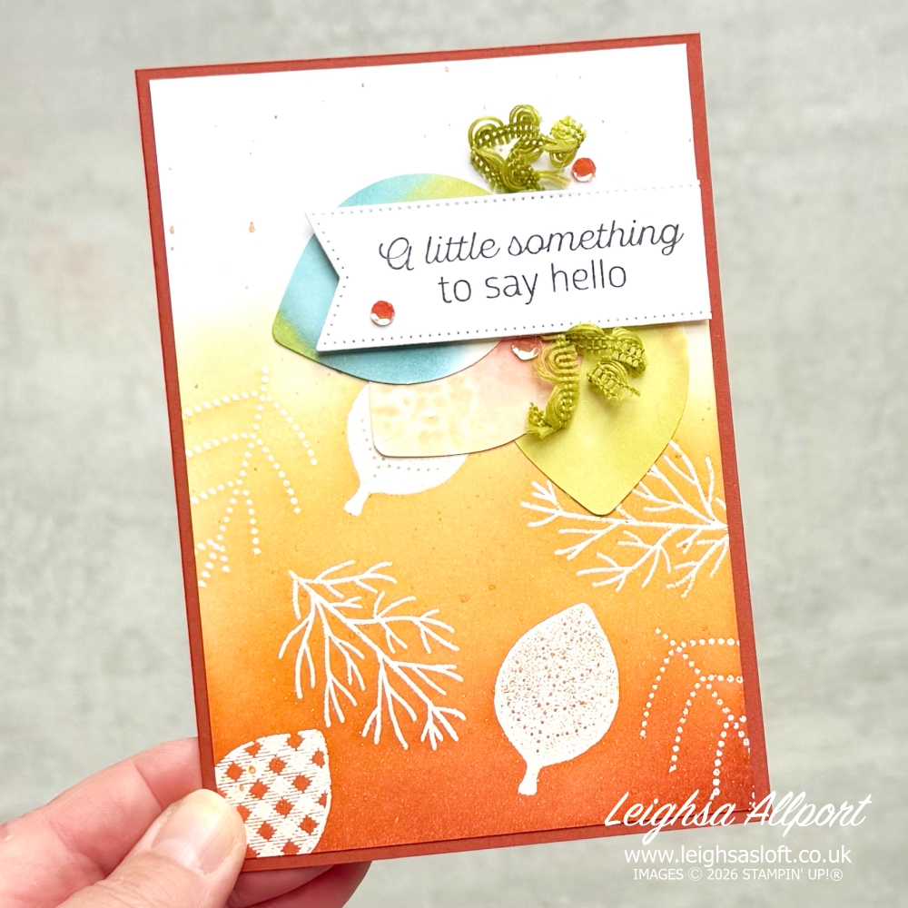A little something to say Hello card, using Simply Leaves Bundle. Emboss resist background blended with Cajun Craze, Timid Tiger and Golden Glow to create an ombre effect. Leaves punched from Basic White coloured by adding blends to acrylic block, spritzing with alcohol and stamped.